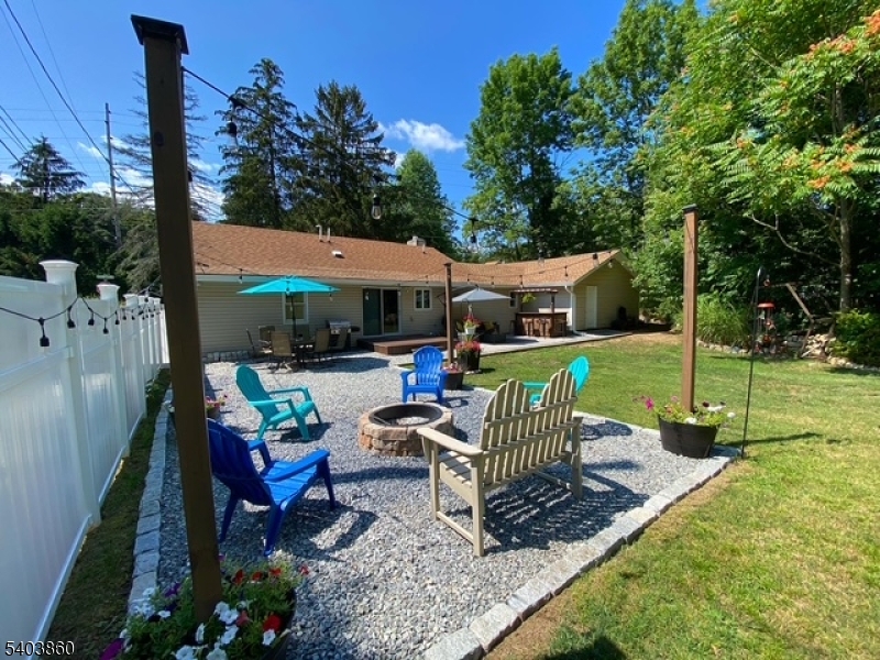 36 Wawayanda Road Vernon, NJ 07422 - Photo 11 of 34 a view of a patio with a table chairs and a yard