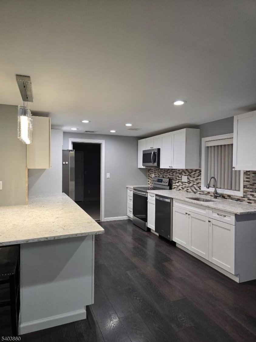 36 Wawayanda Road Vernon, NJ 07422 - Photo 15 of 34 a kitchen with kitchen island sink stove and refrigerator