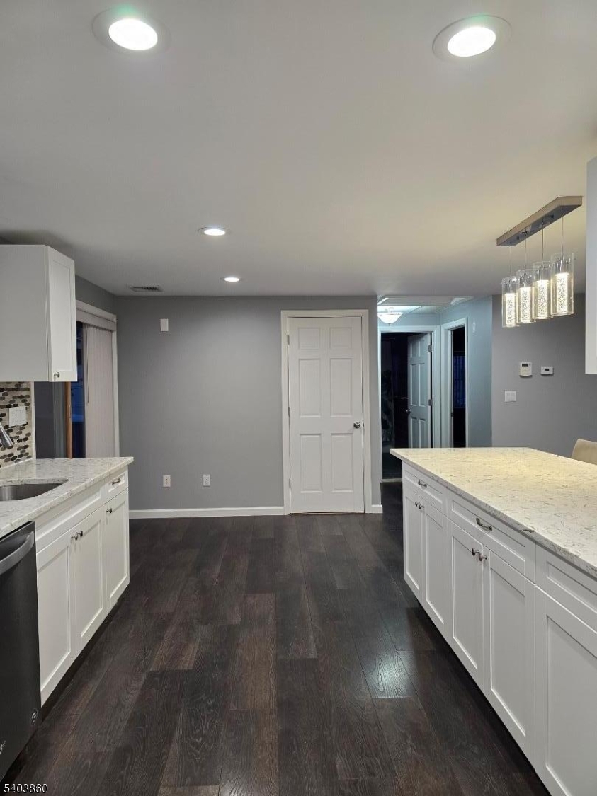 36 Wawayanda Road Vernon, NJ 07422 - Photo 25 of 34 a spacious bathroom with a granite countertop sink a toilet and a bathtub