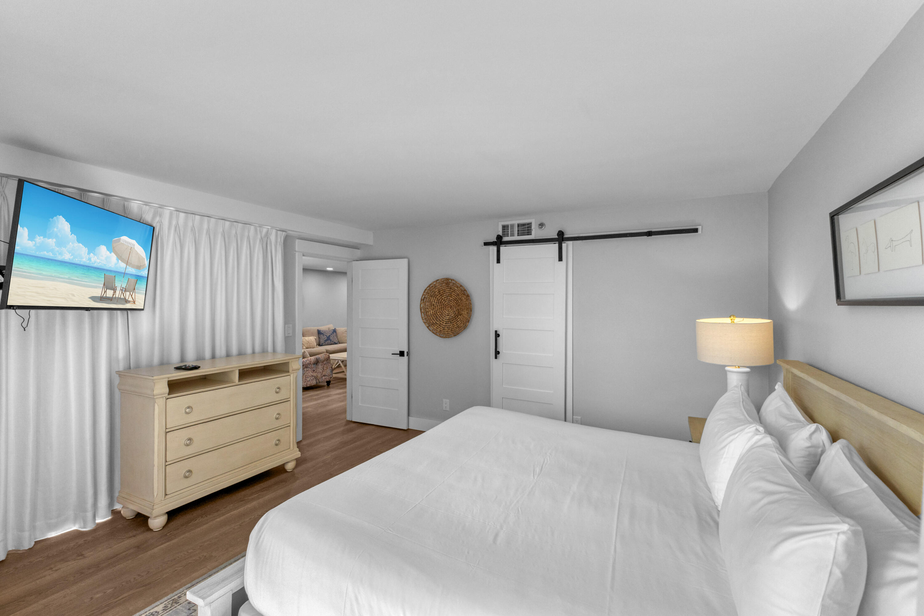 4017 Beachside 1, Unit 4017 Miramar Beach, FL 32550 - Photo 16 of 55 a bedroom with a bed and a dresser