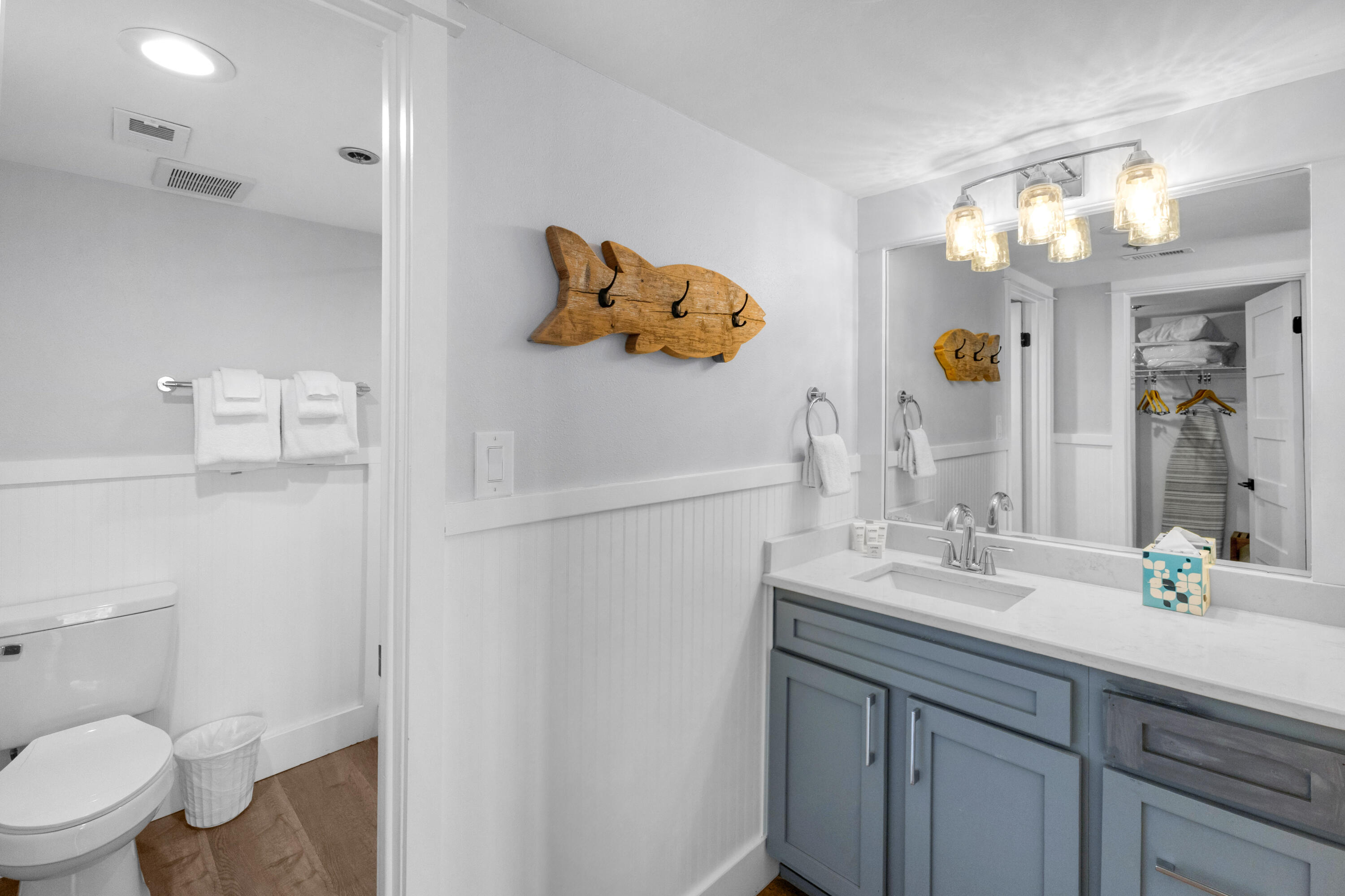 4017 Beachside 1, Unit 4017 Miramar Beach, FL 32550 - Photo 17 of 55 a bathroom with a sink a toilet and mirror