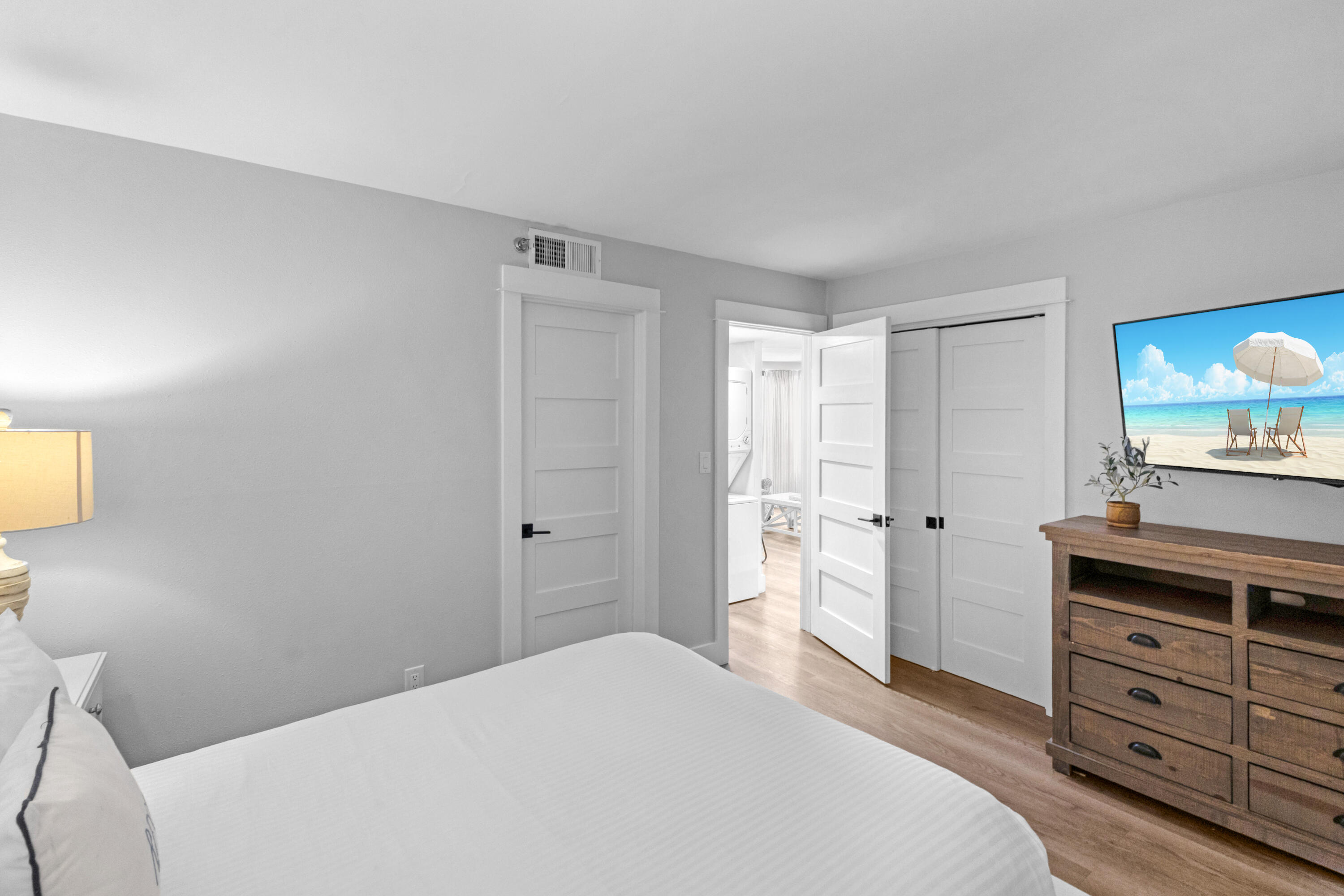 4017 Beachside 1, Unit 4017 Miramar Beach, FL 32550 - Photo 23 of 55 a bedroom with a bed and a dresser in it