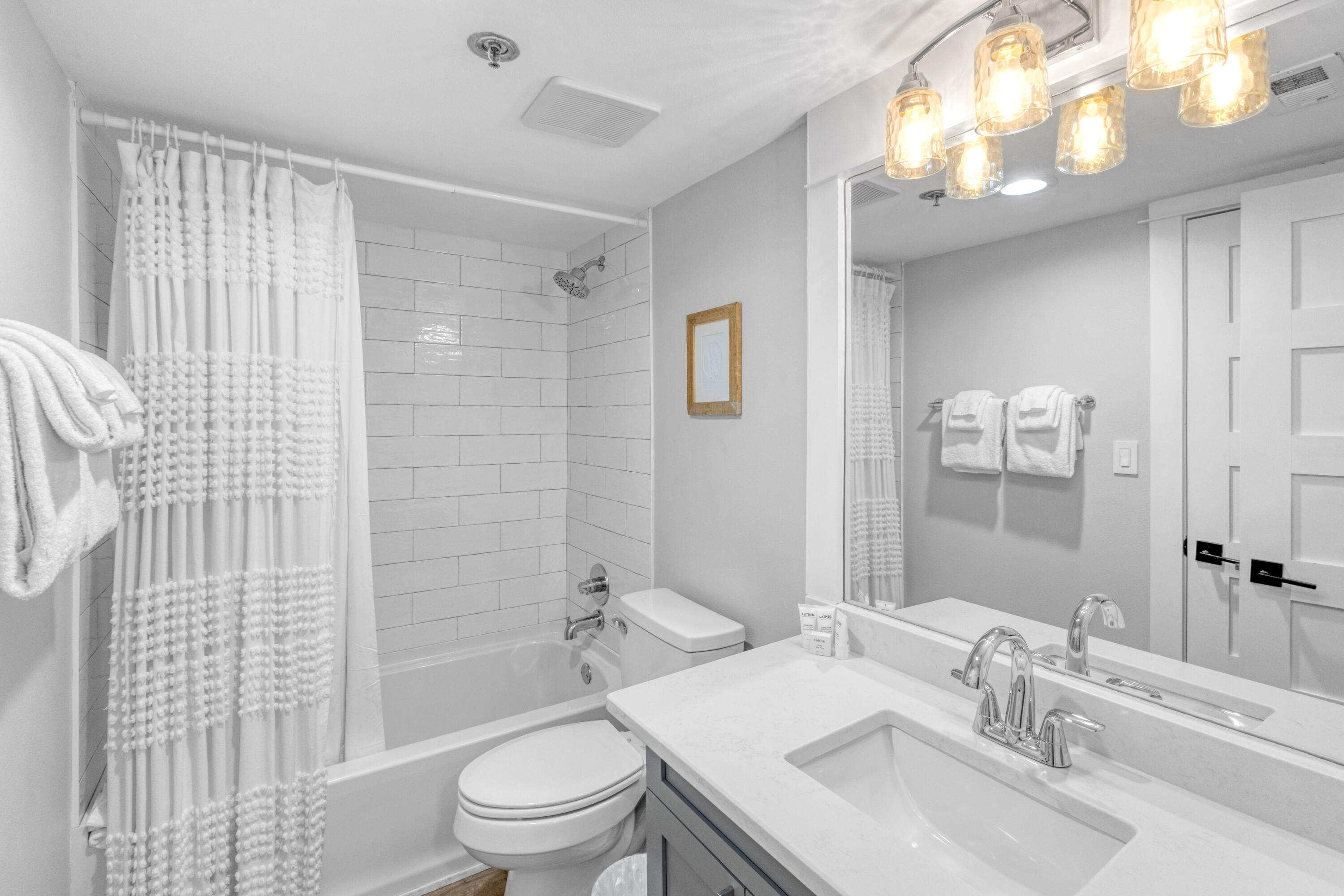 4017 Beachside 1, Unit 4017 Miramar Beach, FL 32550 - Photo 24 of 55 a bathroom with a sink toilet and shower