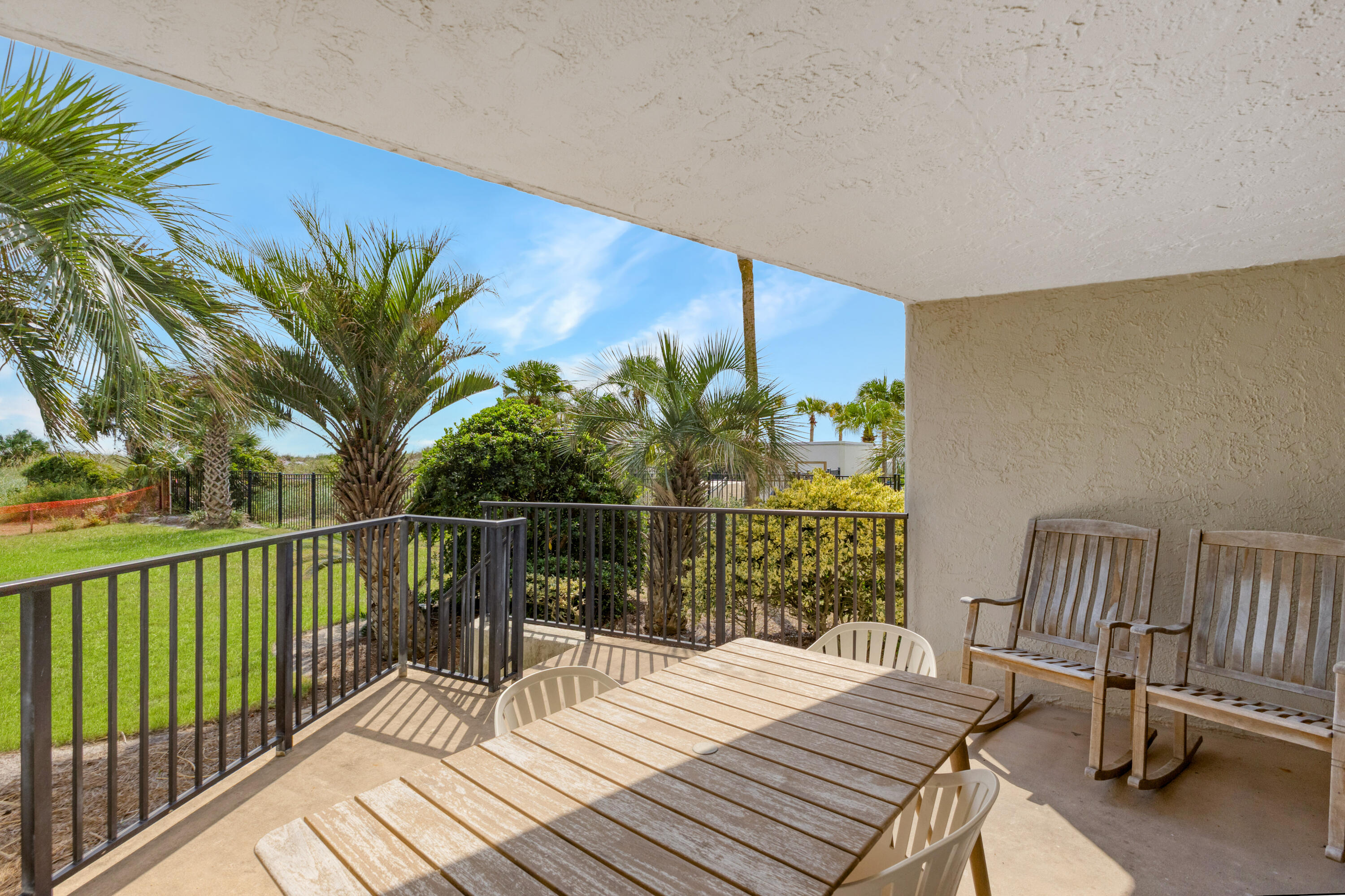 4017 Beachside 1, Unit 4017 Miramar Beach, FL 32550 - Photo 25 of 55 a view of a balcony with chair and wooden floor
