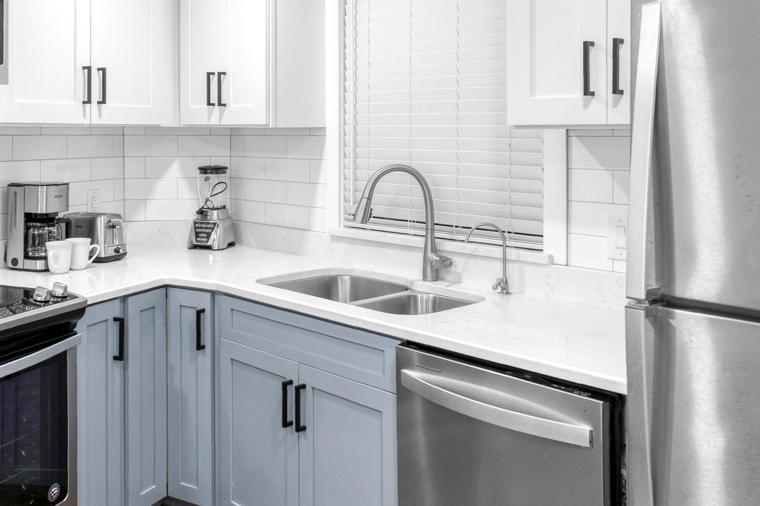 4017 Beachside 1, Unit 4017 Miramar Beach, FL 32550 - Photo 5 of 55 a kitchen with a sink cabinets and stainless steel appliances