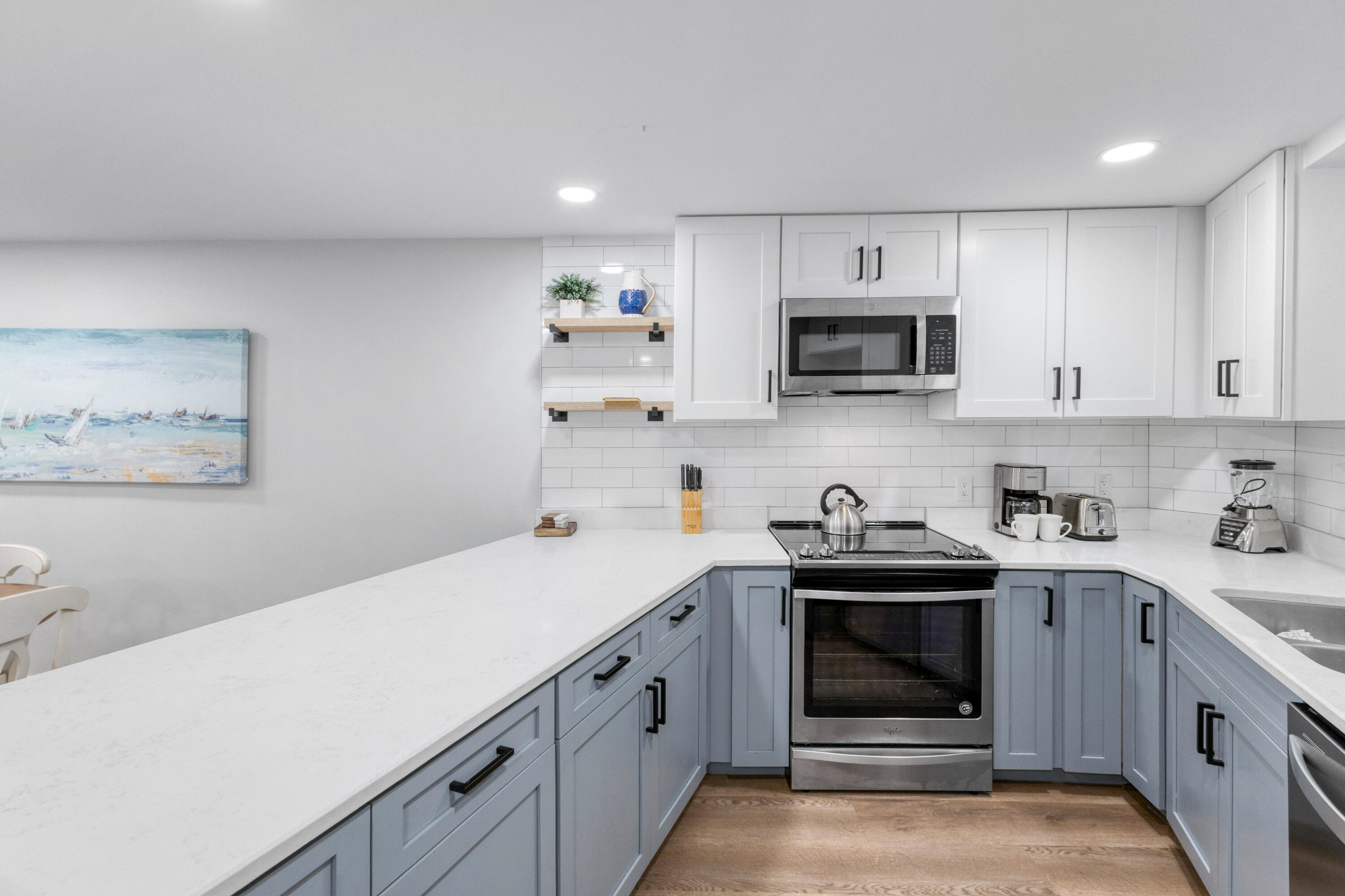4017 Beachside 1, Unit 4017 Miramar Beach, FL 32550 - Photo 6 of 55 a kitchen with stainless steel appliances a stove microwave and sink