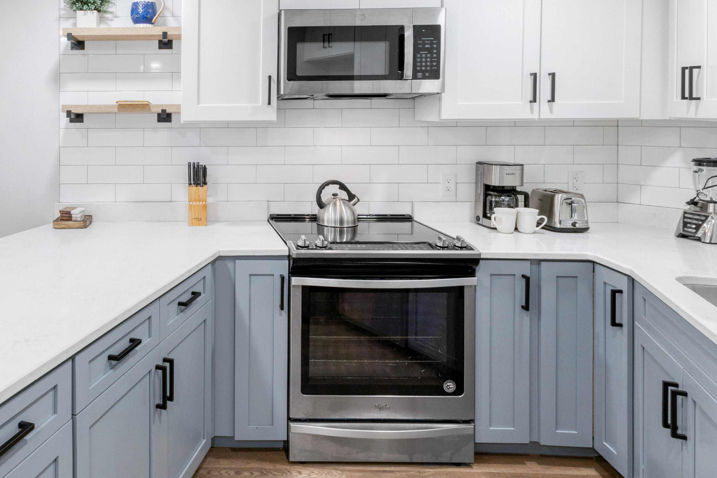 4017 Beachside 1, Unit 4017 Miramar Beach, FL 32550 - Photo 7 of 55 a kitchen with cabinets stainless steel appliances and a sink