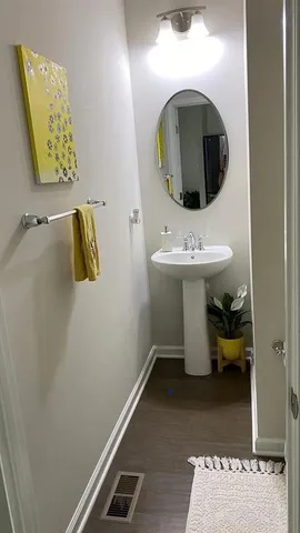 a white toilet sitting next to a shower