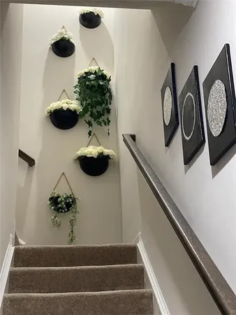 a bathroom with a granite countertop sink toilet mirror and shower