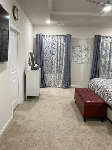 a bedroom with a bed and a chair