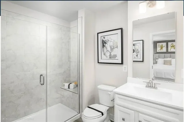 a utility room with a stove a fridge and a window