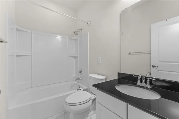 an aerial view of a house with a lake view