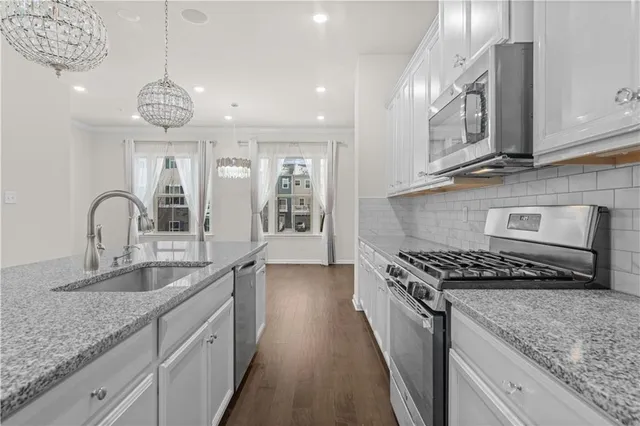 a kitchen with granite countertop a sink and a granite counter tops