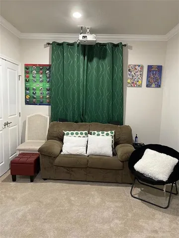 a view of a kitchen with granite countertop a sink stainless steel appliances and living room view