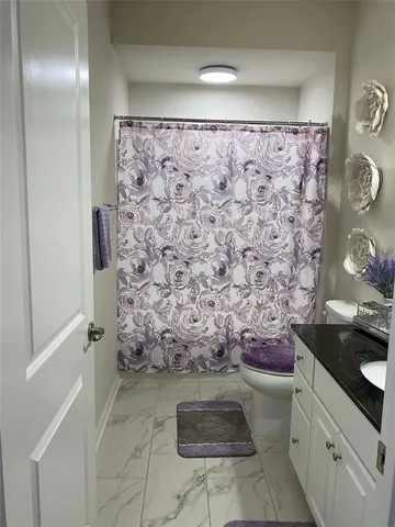 a living room with furniture rug and window