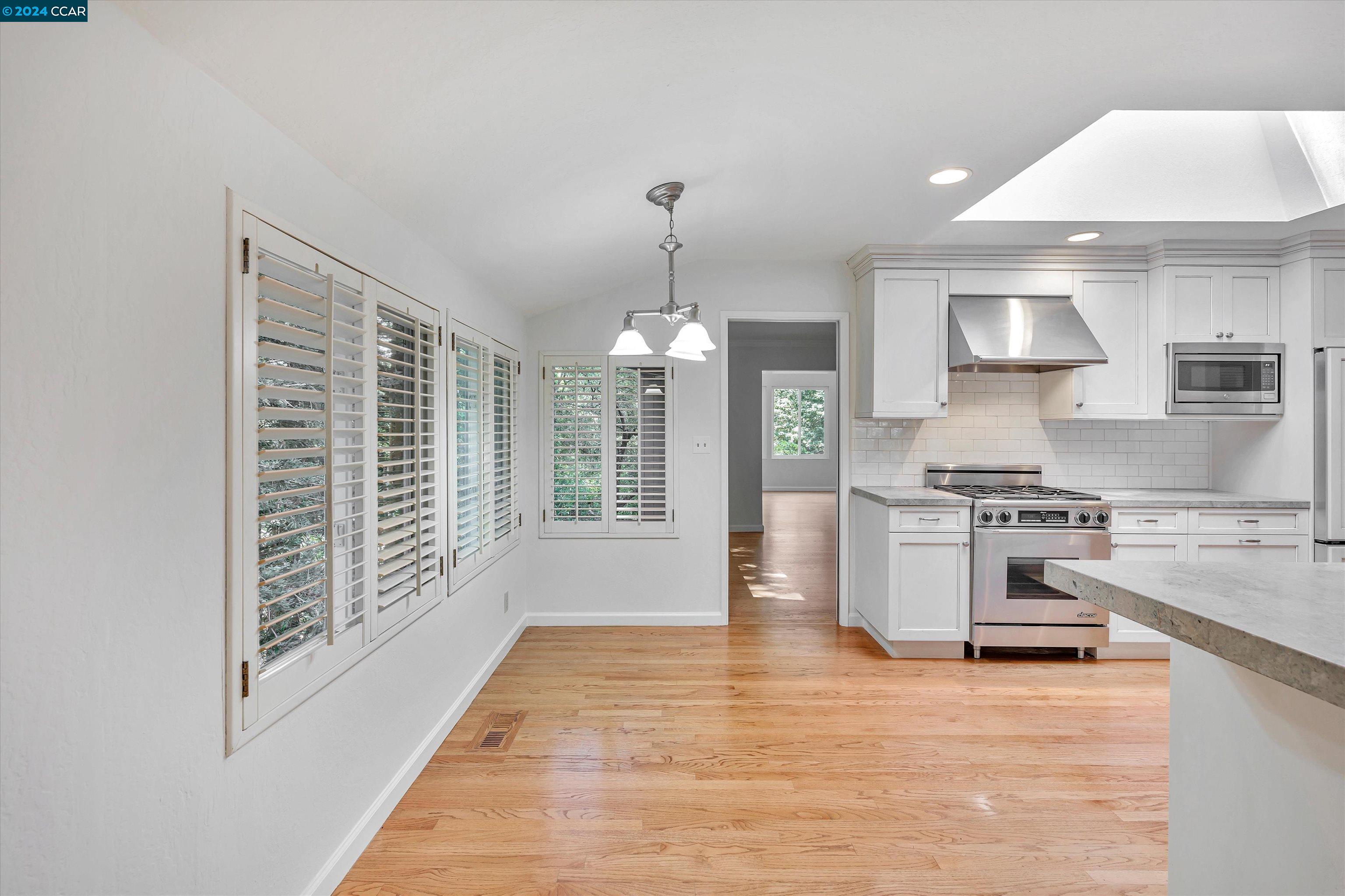 4105 Happy Valley Road Lafayette, CA 94549 - Photo 11 of 30 a kitchen with stainless steel appliances granite countertop a stove a sink and a refrigerator
