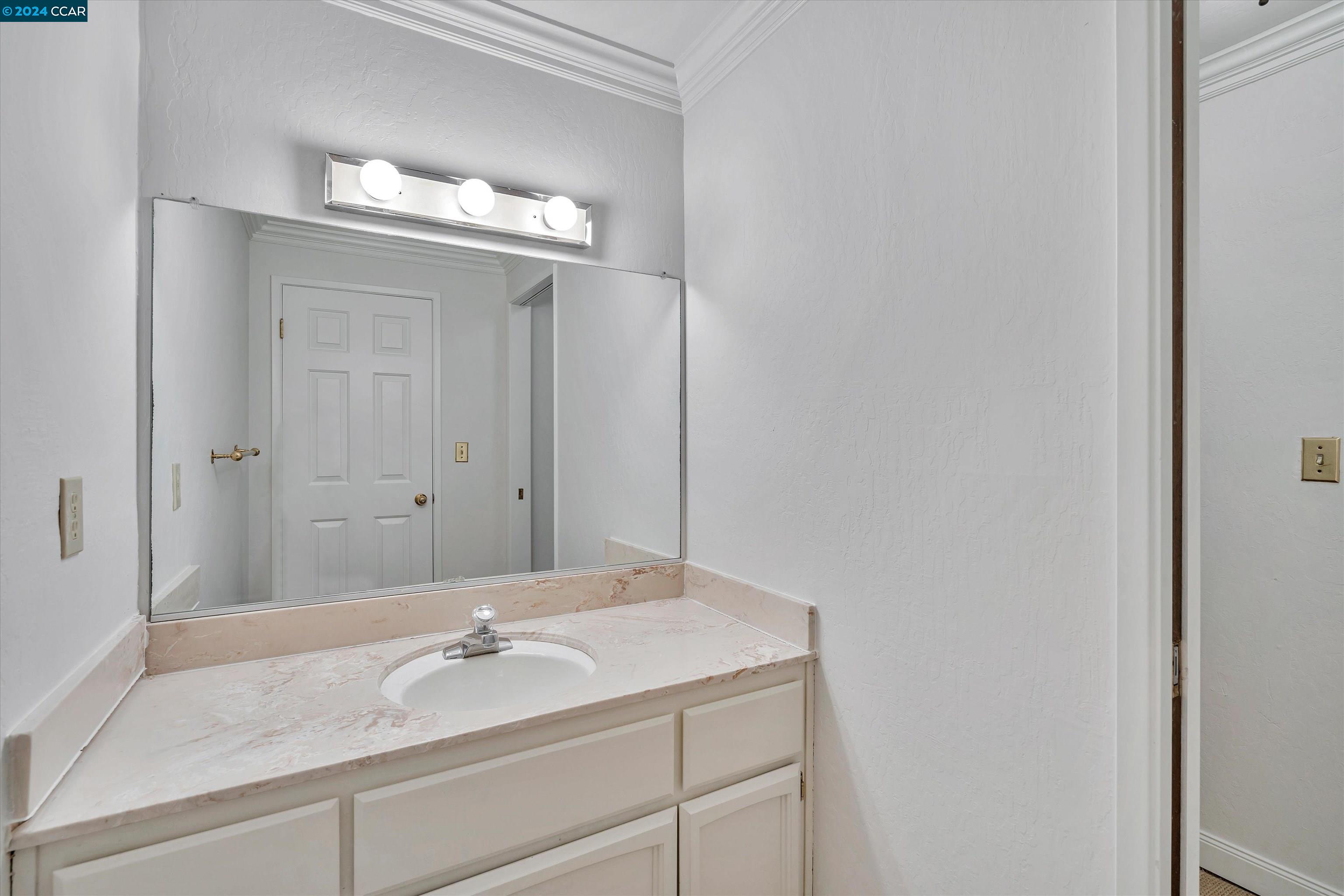 4105 Happy Valley Road Lafayette, CA 94549 - Photo 27 of 30 a bathroom with a sink and a mirror