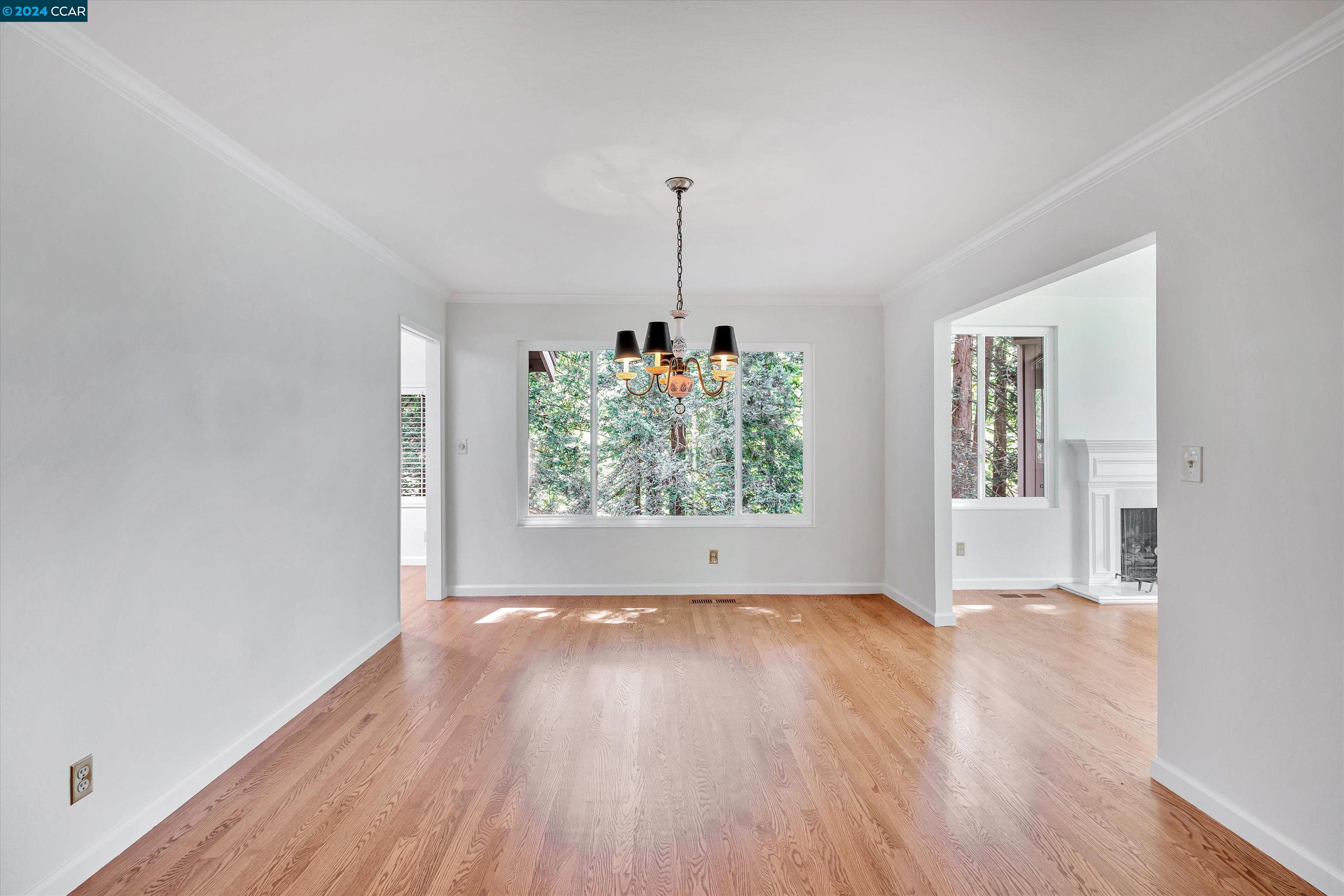 4105 Happy Valley Road Lafayette, CA 94549 - Photo 8 of 30 a view of empty room with window and wooden floor