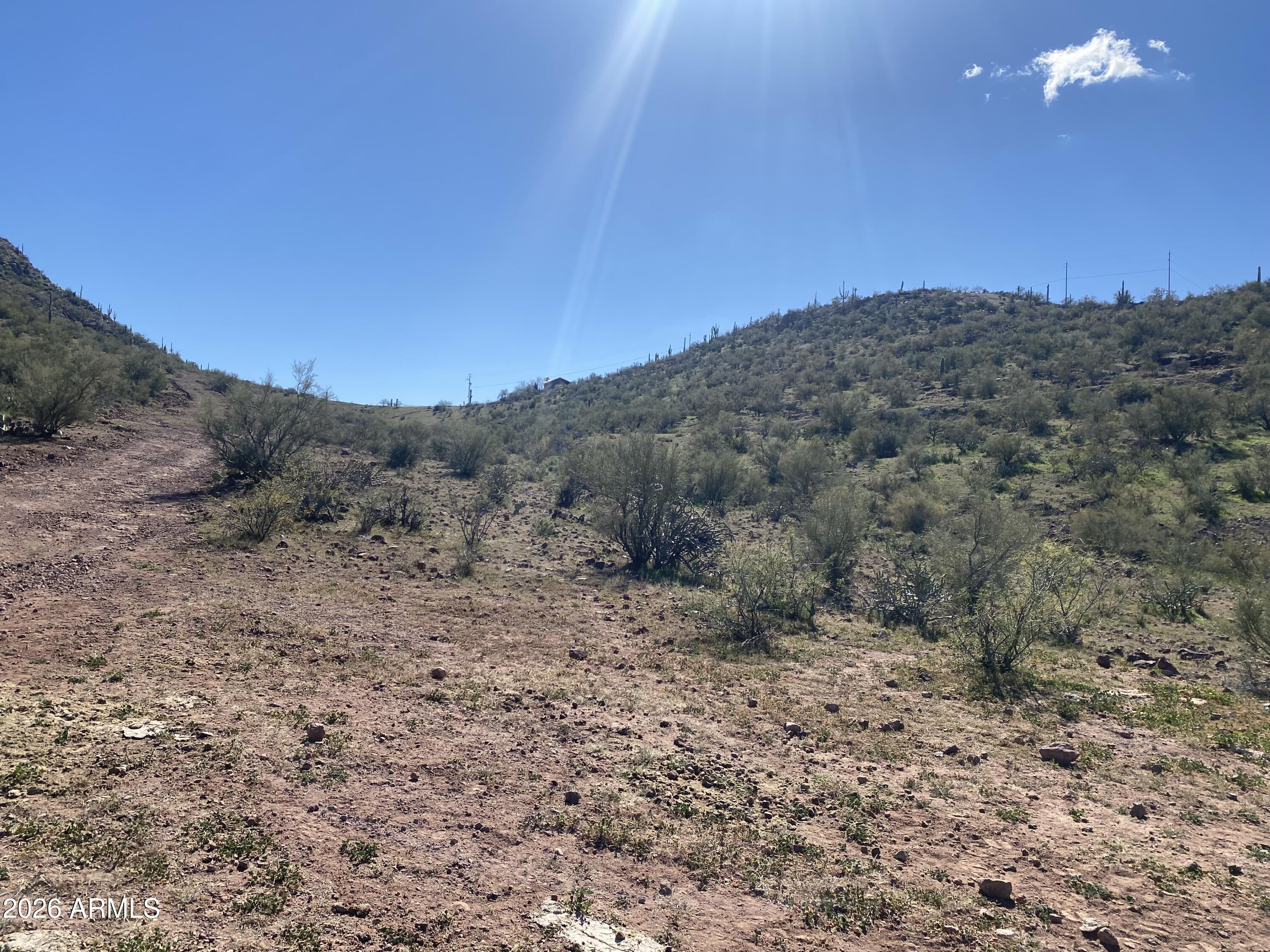 37750 Cow Creek Road, Unit D Morristown, AZ 85342 - Photo 6 of 35 a view of a dry field