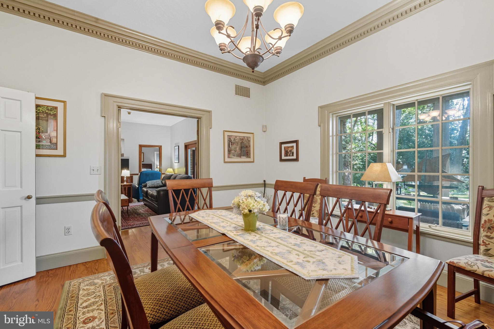 13983 Turners Point Road Kennedyville, MD 21645 - Photo 12 of 62 a living room with furniture and a chandelier