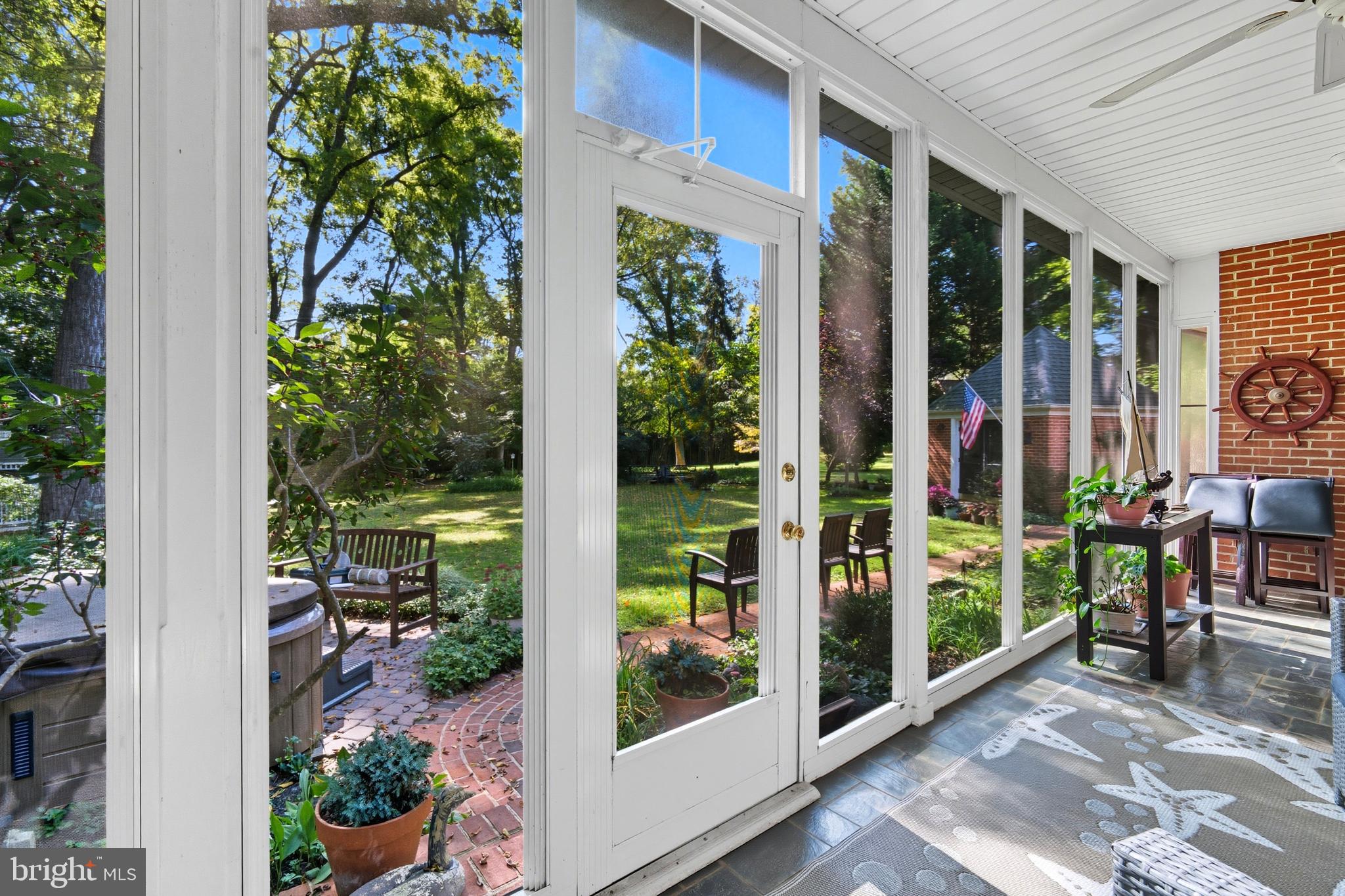 13983 Turners Point Road Kennedyville, MD 21645 - Photo 17 of 62 a view of a porch with a table and chairs