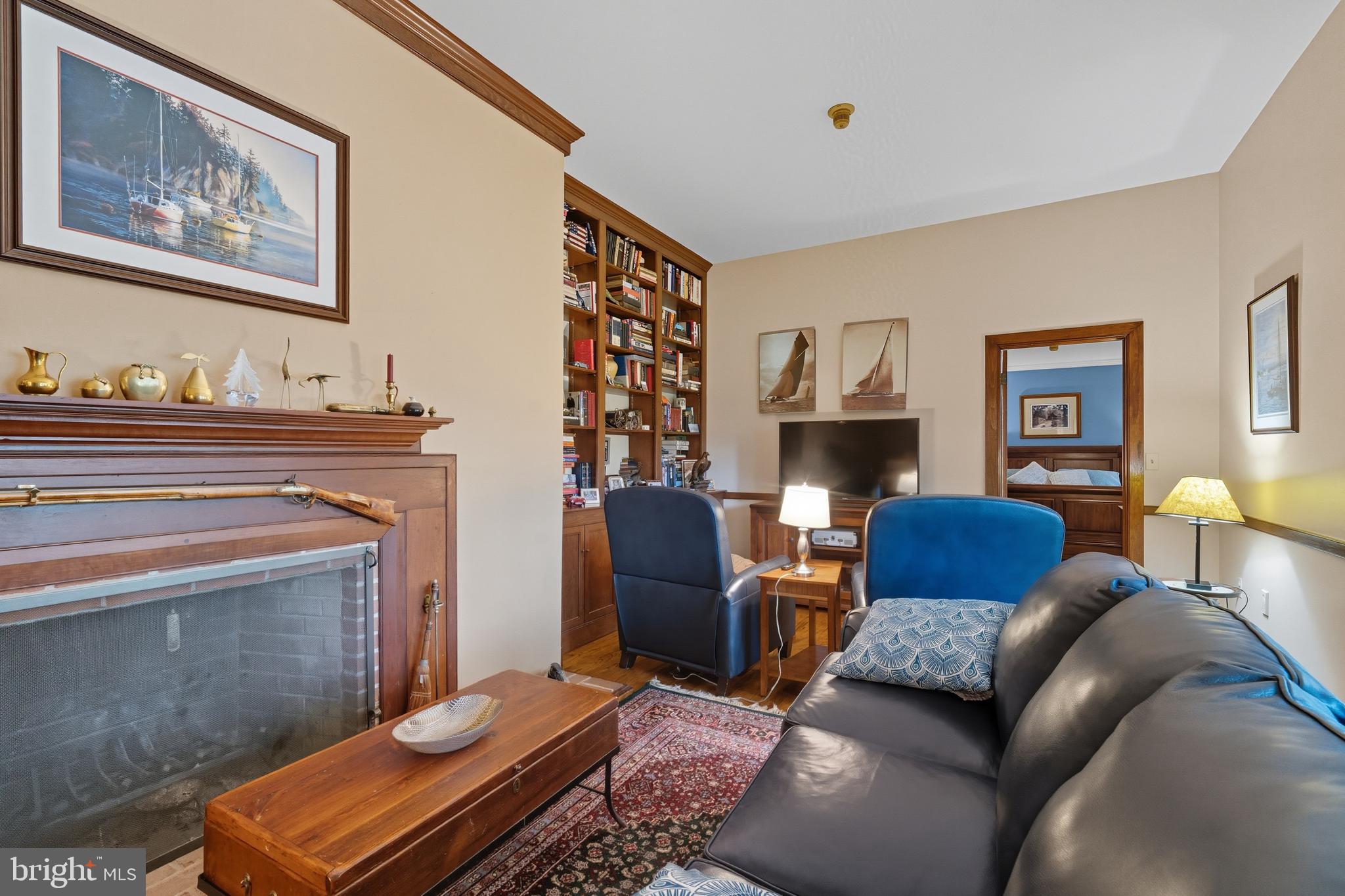13983 Turners Point Road Kennedyville, MD 21645 - Photo 19 of 62 a living room with furniture a couch and paintings on the wall