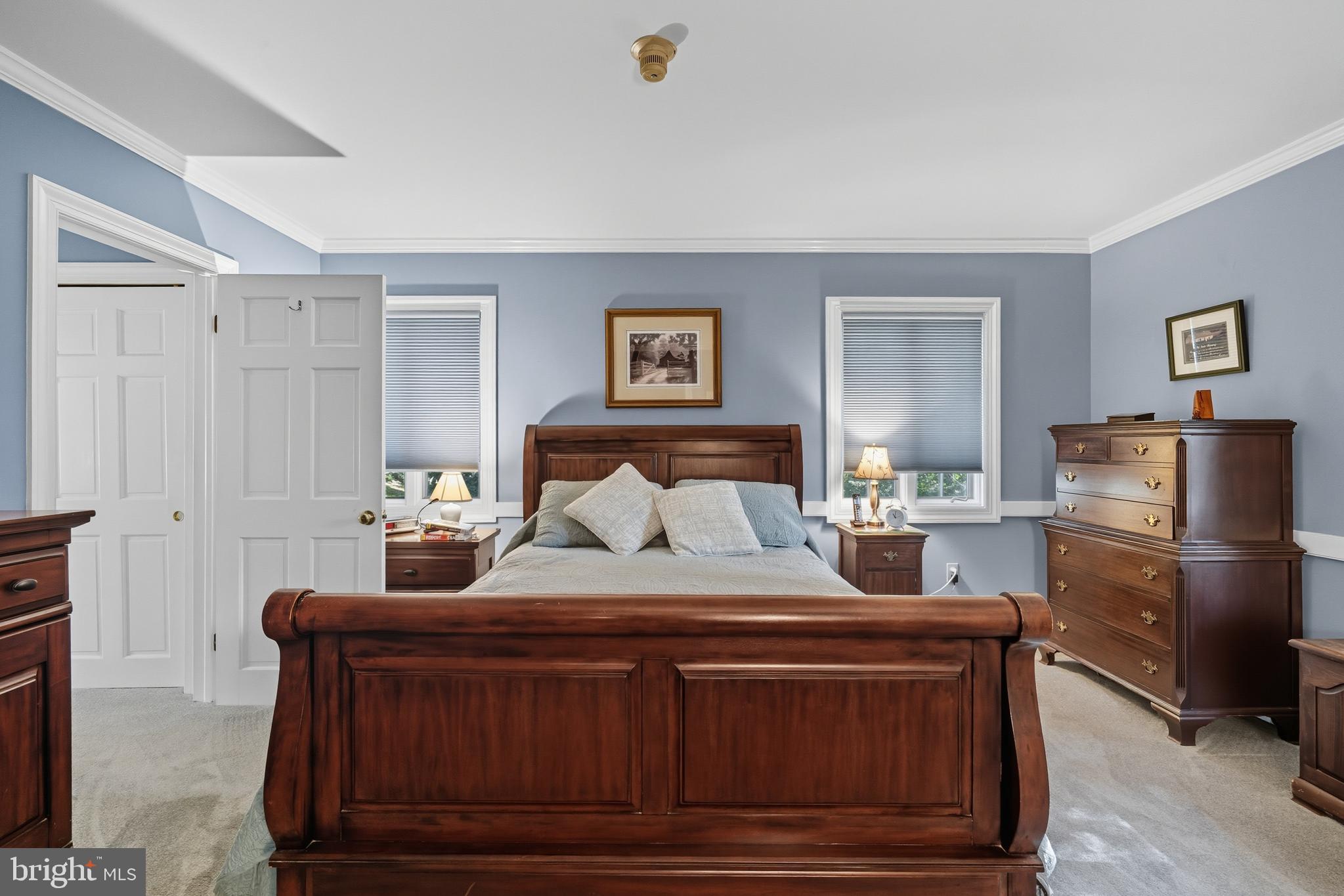 13983 Turners Point Road Kennedyville, MD 21645 - Photo 21 of 62 a bedroom with a bed and wooden floor