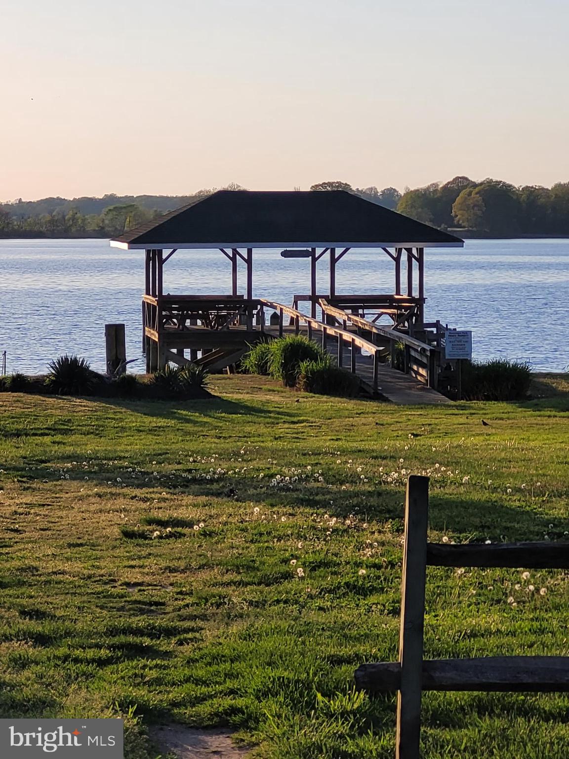 13983 Turners Point Road Kennedyville, MD 21645 - Photo 40 of 62 a view of a lake with a house in the background