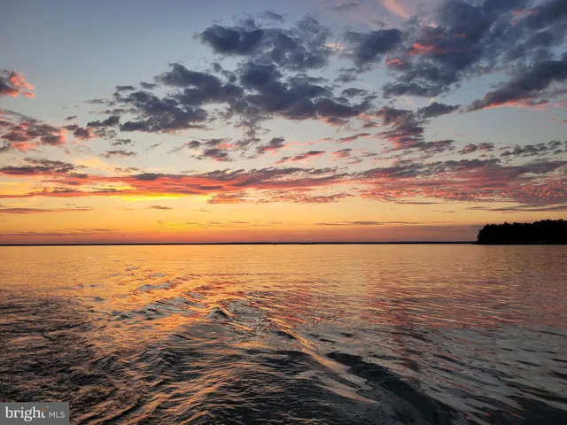 an aerial view of a houses with a yard