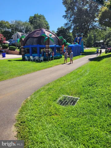an aerial view of a houses with a lake view