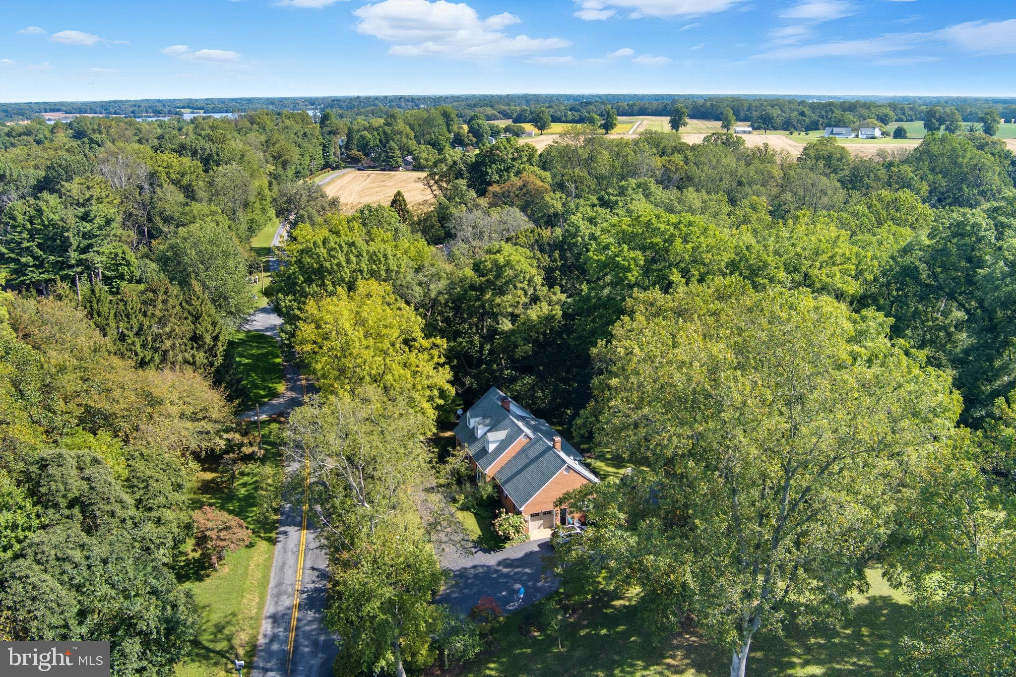 13983 Turners Point Road Kennedyville, MD 21645 - Photo 52 of 62 an aerial view of a house with a yard