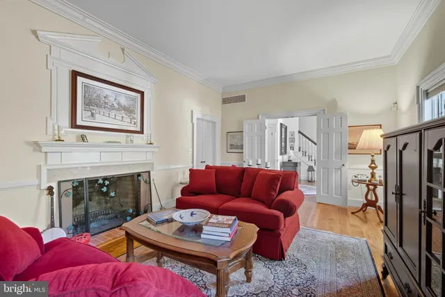 a living room with furniture or fireplace and a wooden floor