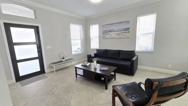 a living room with furniture and a window