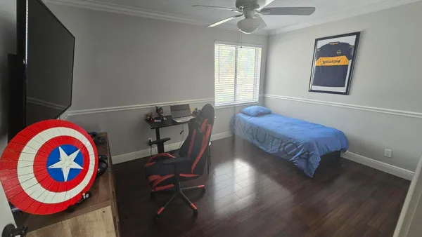 a bedroom with bed and a window