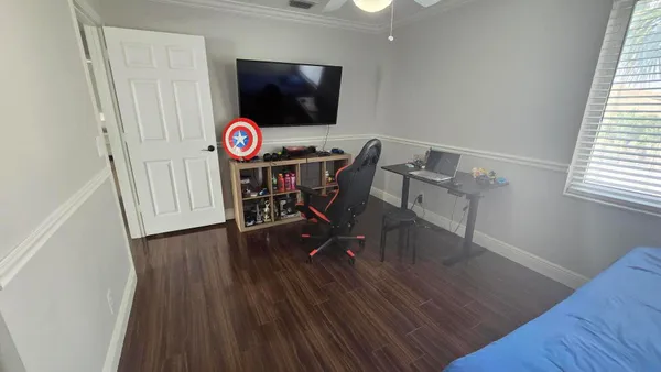 a view of a livingroom with furniture and wooden floor