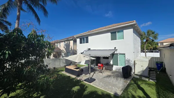 a view of house with patio outdoor seating area