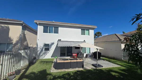 a front view of a house with entertaining space