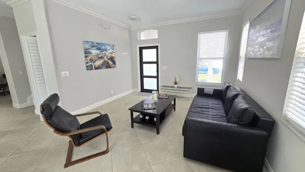 a living room with furniture and a window