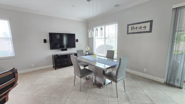 a view of a livingroom with furniture and a window