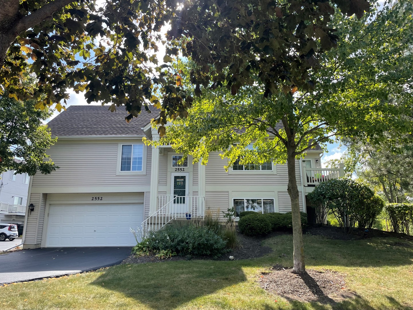 2552 Hatfield Court Elgin, IL 60123 - Photo 1 of 13 a front view of a house with garden