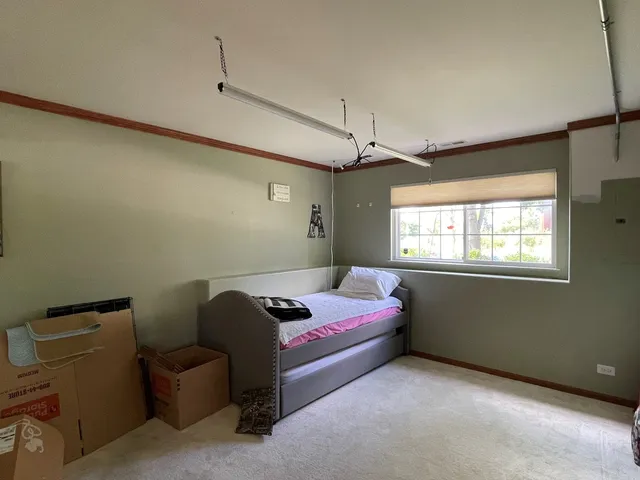 a bedroom with bed and window