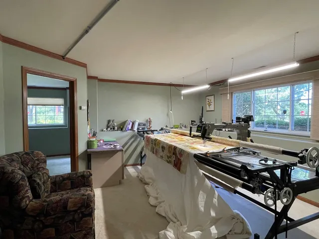 a living room with furniture a window and a table