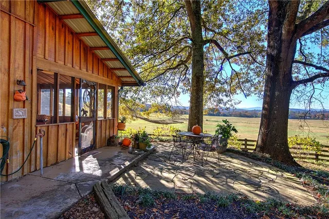 a kitchen with stainless steel appliances kitchen island granite countertop a refrigerator and cabinets