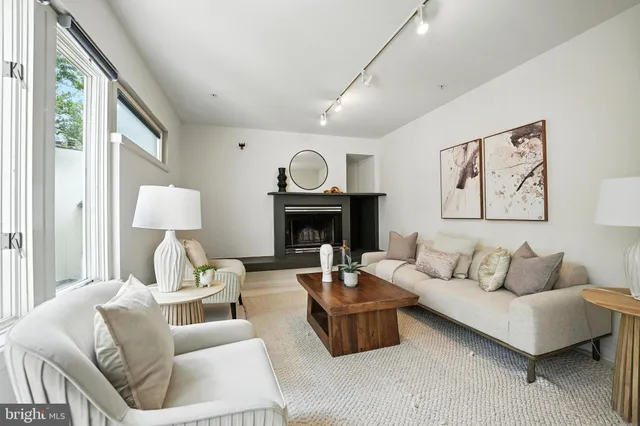 a spacious bedroom with a bed and wooden floor