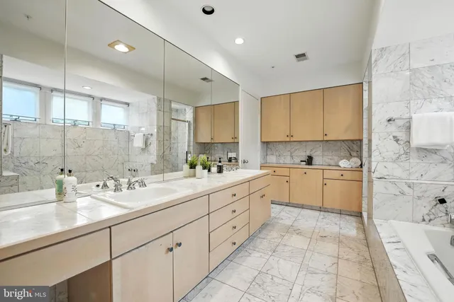a view of a bathroom with a tub and toilet