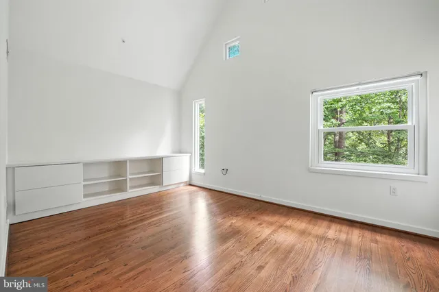 a view of a porch with wooden floor