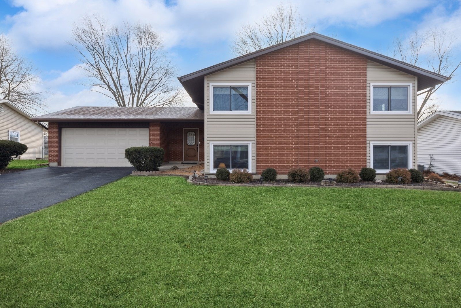 2711 Mitchell Drive Woodridge, IL 60517 - Photo 1 of 1 a house view with a garden space