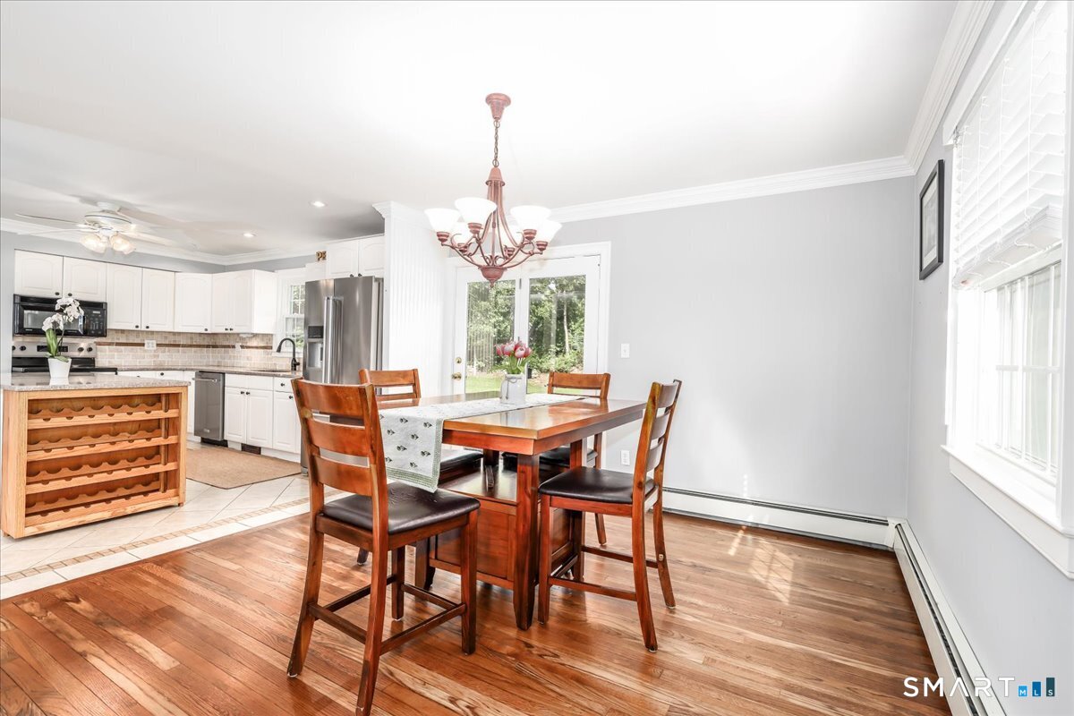 19 Botsford Hill Road Newtown, CT 06470 - Photo 14 of 40 a view of a dining room with furniture window and wooden floor