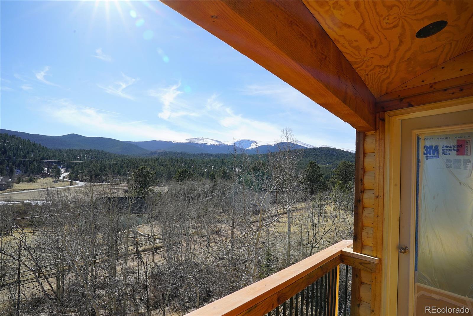 144 North Random Road Bailey, CO 80421 - Photo 3 of 9 a view of a lake from a balcony