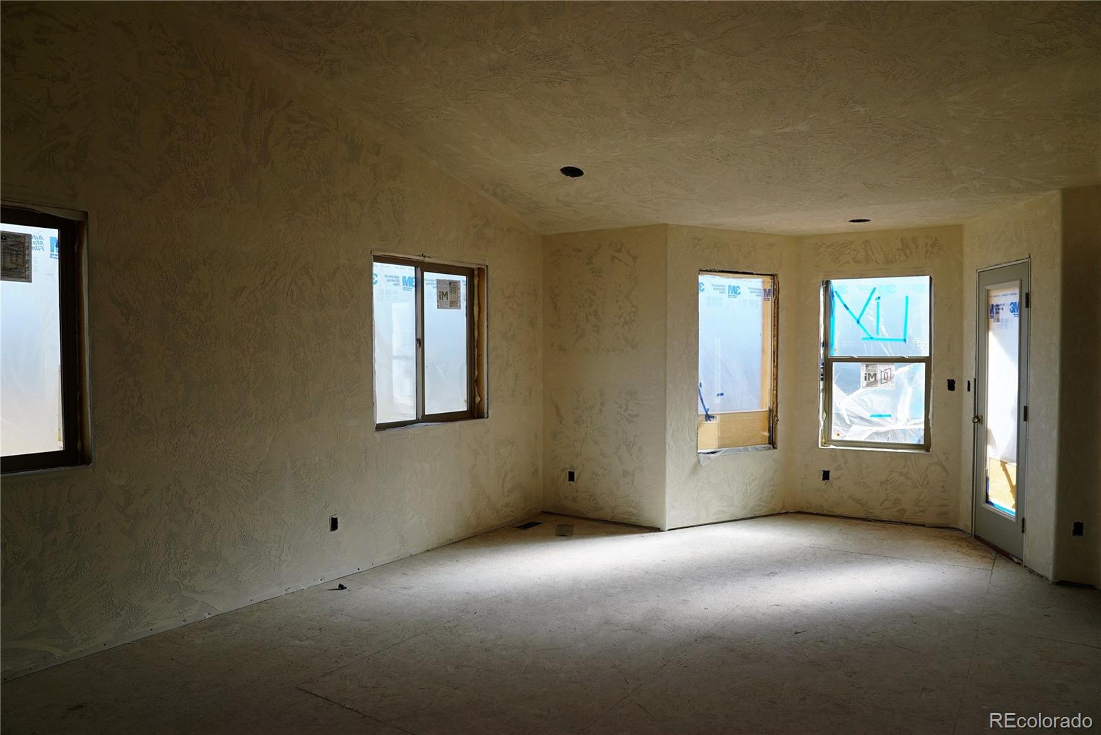 144 North Random Road Bailey, CO 80421 - Photo 5 of 9 a view of an empty room with a window
